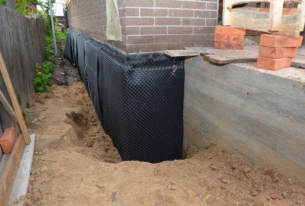 Happy homeowners after waterproofing job in Flint